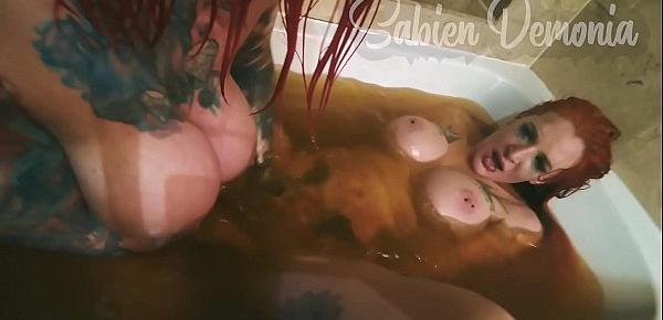  Two slutty tattooed redheads fucks each other in bathtub  and suck of photographer